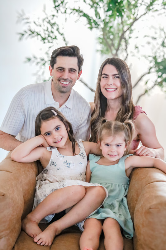 Family of four, seated studio portrait