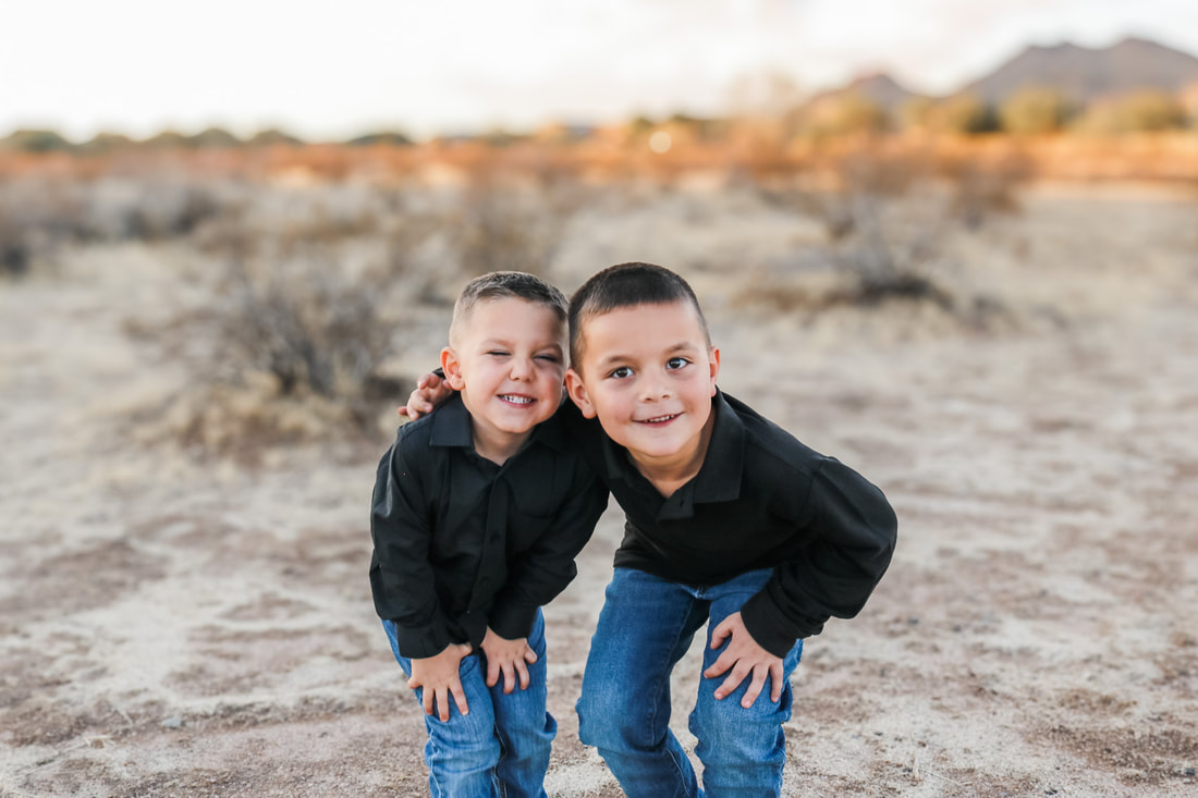 Two brothers laughing, desert session